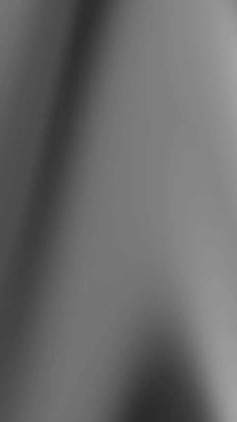 Blurry grey gradient with diagonal light streaks, ideal for abstract backgrounds Stock Footage 306223154