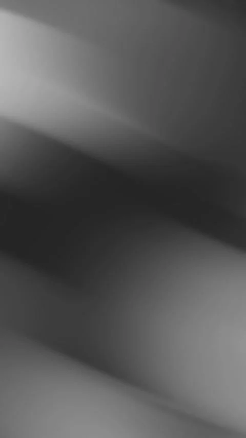 Blurry grey gradient with diagonal light streaks, ideal for abstract backgrounds Video stock 306223197