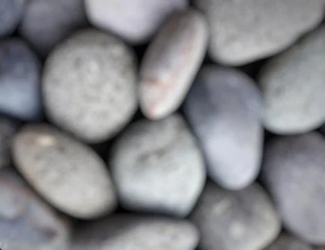 Blurry grey pebbles background Stock Photos