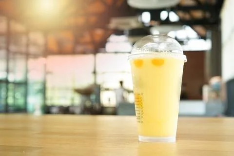 Blurry iced mango tango at Cafe Coffee to drink cold drinks in the evening, p Stock Photos