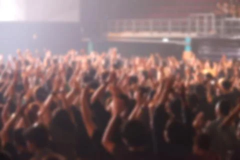 Blurry image background of many audience concert in big rock concert. Stock Photos