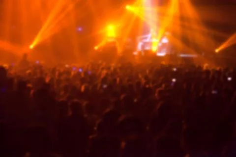 Blurry image background of many audience concert in big rock concert. Stock Photos