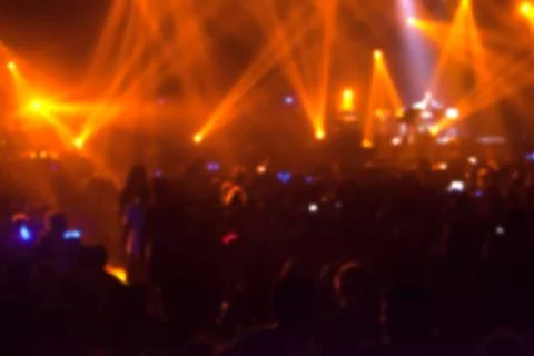 Blurry image background of many audience concert in big rock concert. Stock Photos