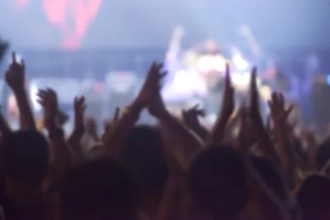 Blurry image background of many audience concert in big rock concert. Stock Photos