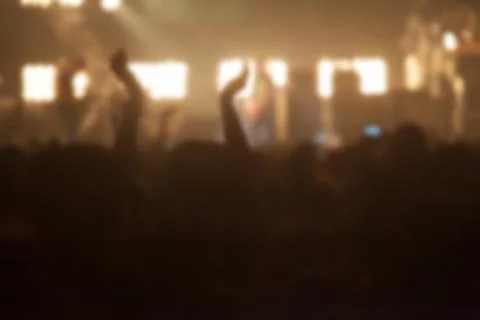 Blurry image background of many audience concert in big rock concert. Stock Photos