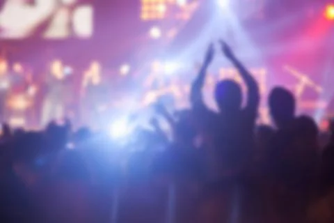 Blurry image background of many audience concert in big rock concert. Stock Photos
