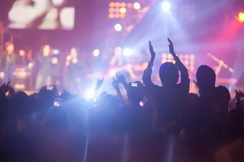 Blurry image background of many audience concert in big rock concert. Stock Photos