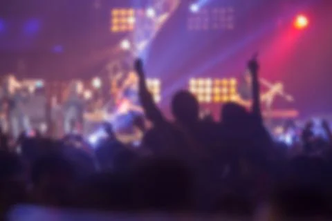 Blurry image background of many audience concert in big rock concert. Stock Photos