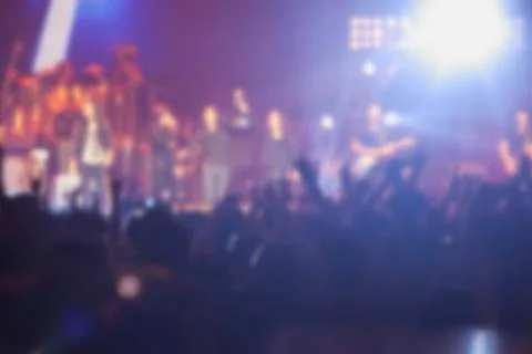 Blurry image background of many audience concert in big rock concert. Stock Photos