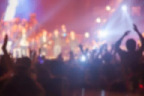 Blurry image background of many audience concert in big rock concert. Stock Photos