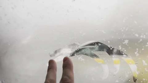 A blurry image of a car windshield with a lot of rain on it Stock-Footage 276065013