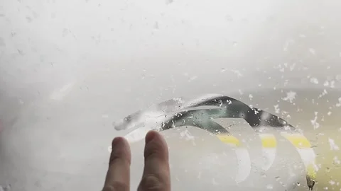 A blurry image of a car windshield with a lot of rain on it Stock-Footage 278442767