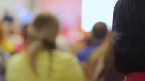 Blurry image of a classroom with a woman in the back Stock Footage 302260868