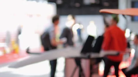 Blurry image of a crowded room with people standing around and talking Video stock 310978244