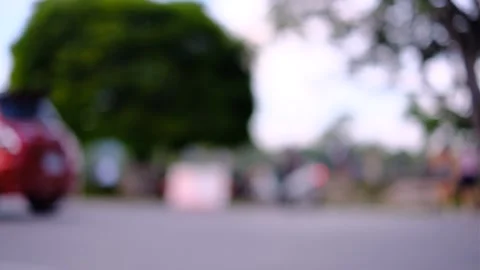 A blurry image of people walking and running in a park. Stock Footage 295198692