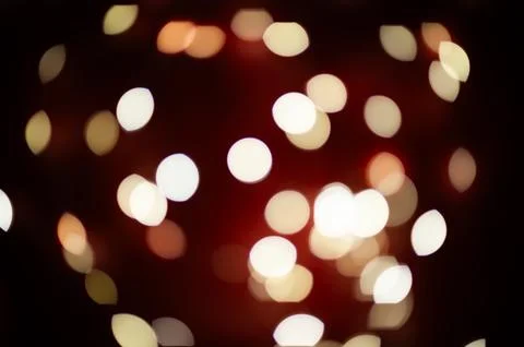A blurry image of a red background with many white circles Stock Photos