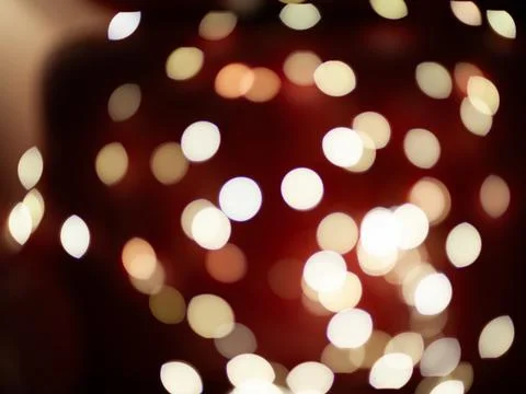 A blurry image of a red background with many white circles Stock Photos