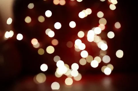 A blurry image of a red background with many white circles Stock Photos