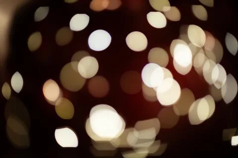 A blurry image of a red background with many white circles Stock Photos