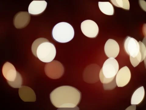 A blurry image of a red background with many white circles Stock Photos