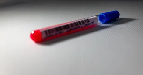 Blurry image of a Sample blood in test tube of Coronavirus (Covid-19). Corona Stock Photos