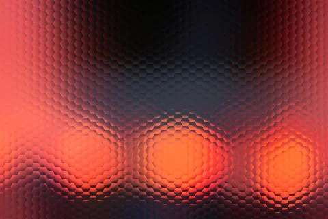 A blurry image of three orange circles with a red background. Stock Photos