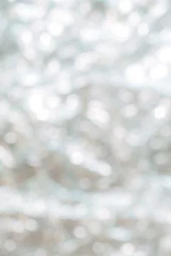 A blurry image of a white background with a few white dots scattered around Stock Photos