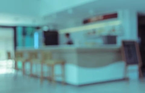 Blurry interior of coffee bar with stools Stock Photos