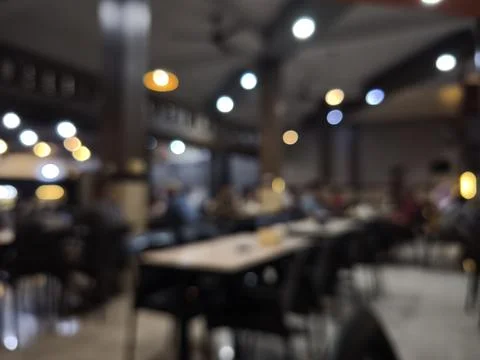 Blurry interior of a restaurant dining area. Stock Photos