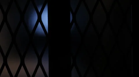 BLURRY LIGHTS BEHIND FENCE Stock Footage 28014076