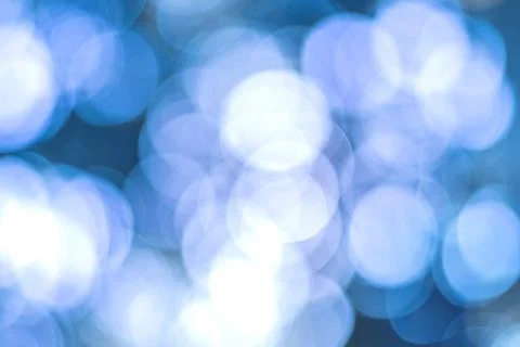 Blurry lights on blue background. Stock Photos