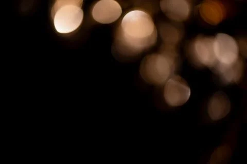 Blurry lights create soft, out of focus golden circles, adding warm glow and  Foto stock