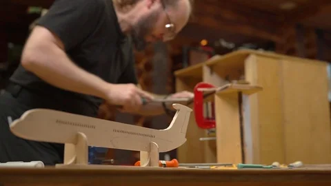 Blurry man with beard polishes outdated airplane detail Stock Footage 127112749