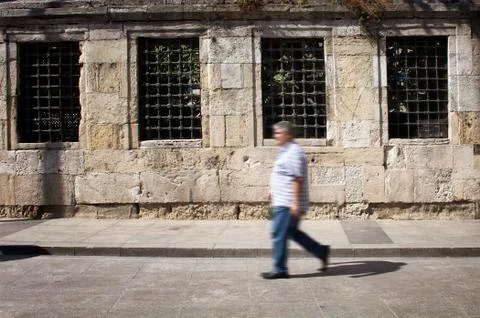 Blurry motion image of middle age man walking Stock Photos