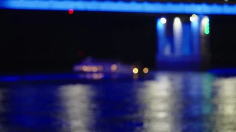 Blurry night river landscape with illuminated bridge bokeh and reflections. Stock Footage 342372704