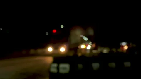 Blurry night scene with glowing lights creating an abstract bokeh effect in.. Vidéo 339425402