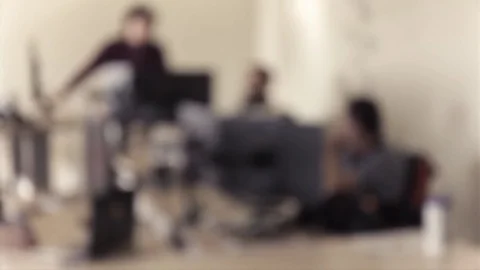 Blurry office environment with employee working together Stock Footage 74874388