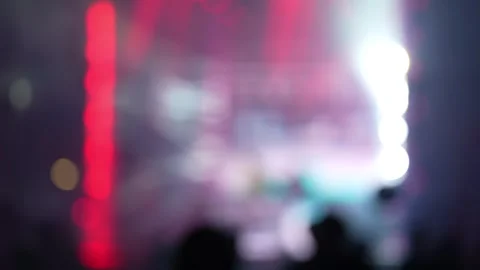 A blurry out of focus colorful stage lights at concert crowd. Stock Footage 343239659