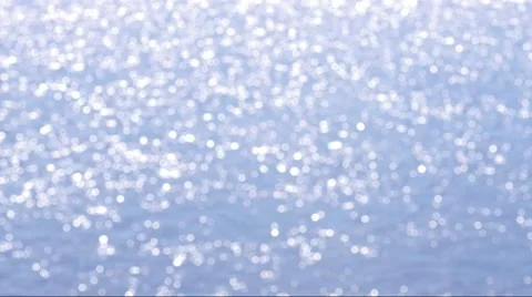 Blurry, out of focus water surface with sparkles from the sun and waves Stock Footage 51373334