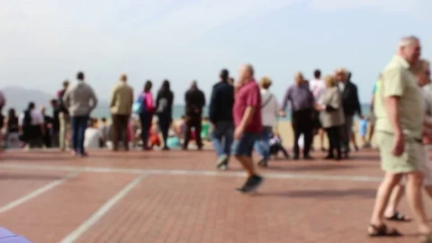 Blurry people walking on the seafront in Las Palmas, Gran Canaria, Spain Stock Footage 72153908