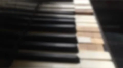Blurry piano keys smooth camera Stock Footage