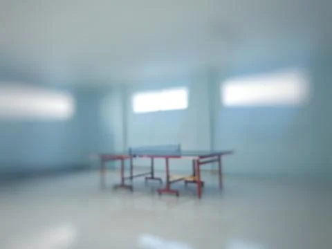 Blurry ping pong table on defocus background inside the room 스톡 사진