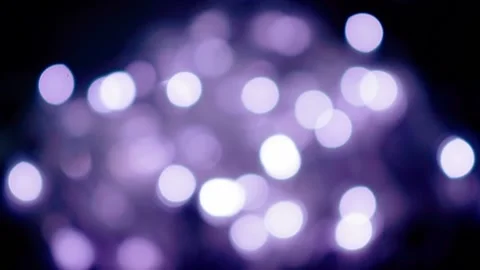 Blurry purple bokeh spheres in the dark. abstract defocused festive christmas li Stock Footage 162698053