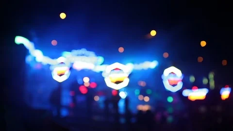 Blurry shot of moving carousel ride at night at a carnival Stock Footage 122512531