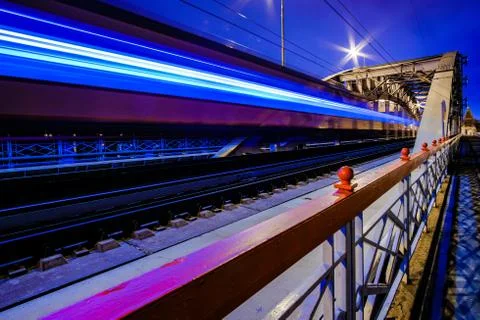 Blurry streaks of light from a speeding train. The train passes through the Stock Photos