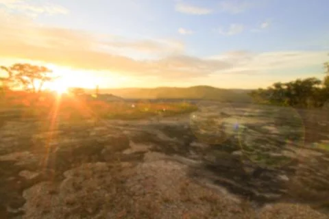Blurry sunset mountain forest and sky view from the top of the mountain. Stock Photos