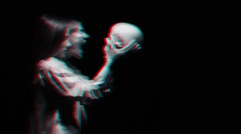 Blurry terrible portrait of a ghost witch girl with a dead man's skull Fotos de archivo