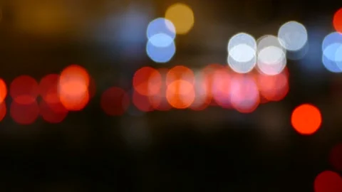 Blurry traffic lights at night, abstract bokeh background, unfocused road tra Stock Footage 174412922