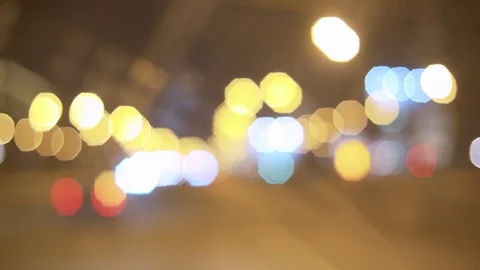 Blurry traffic lights in the night Stock Footage 128699283