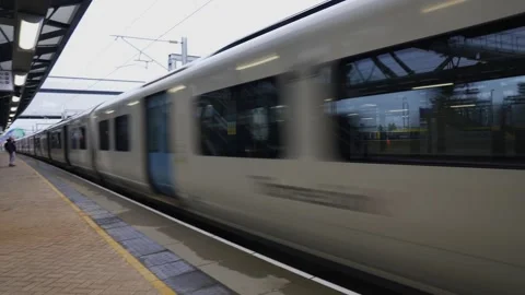 A blurry train window with a reflection of a person in the window Stock Footage 297858798